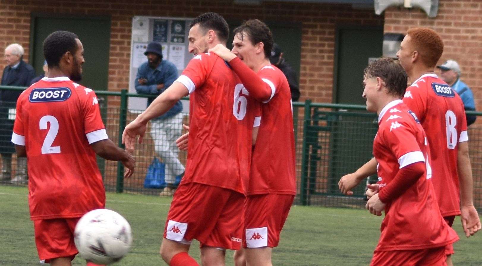 Faversham goalscorer Ben Gorham celebrates with team-mates Tariq Ossai, Billy Bennett, Nathan Wood and Tashi-Jay Kwayie in Saturday’s 1-0 FA Vase victory at Fisher. Picture: Alan Coomes