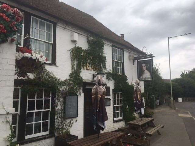 From the roadside The Queens Head in Kingsnorth, freshly hosed down and washed, looks a traditional village boozer, but once inside it’s something of a Tardis