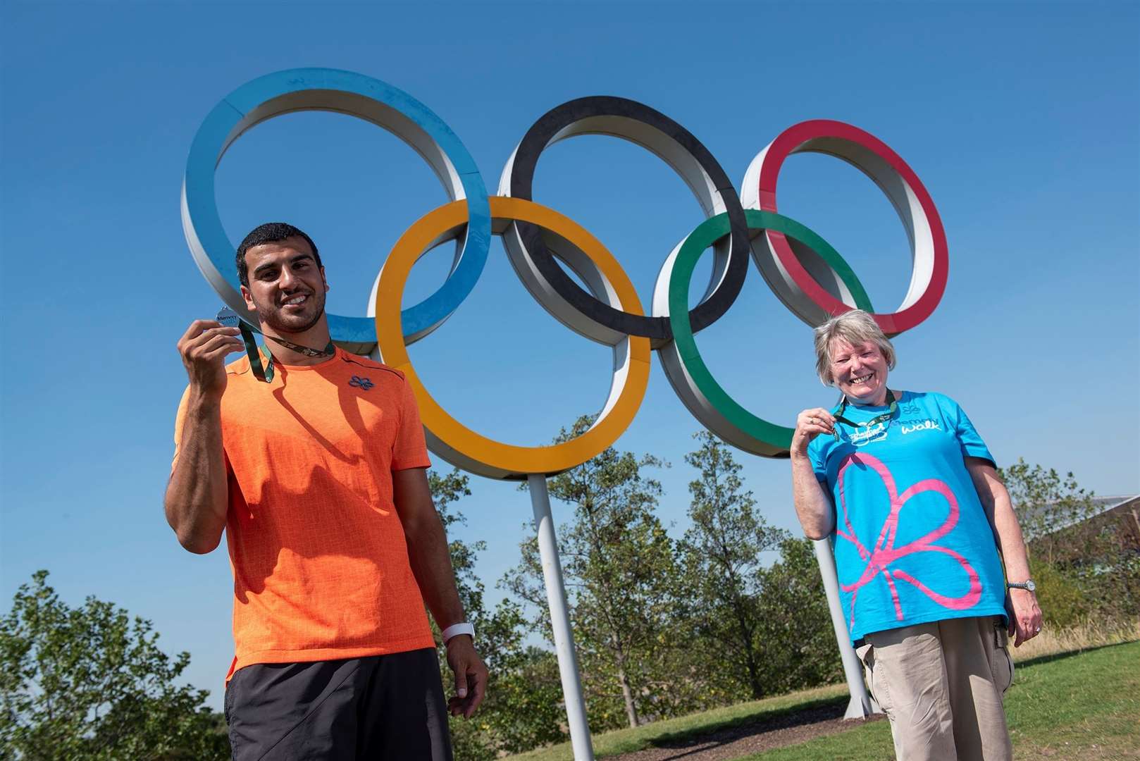 GB athlete Adam Gemili and carer Christine Seddon with his medals. Picture: Alzheimer's Society