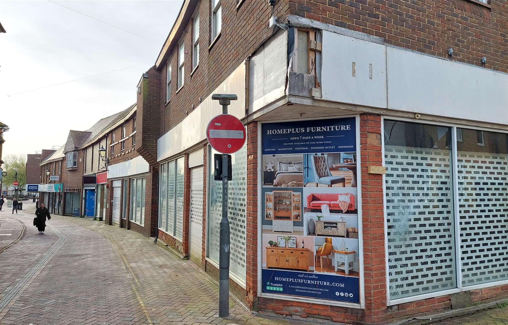 Hoardings have now been taken down, leaving the empty shops exposed