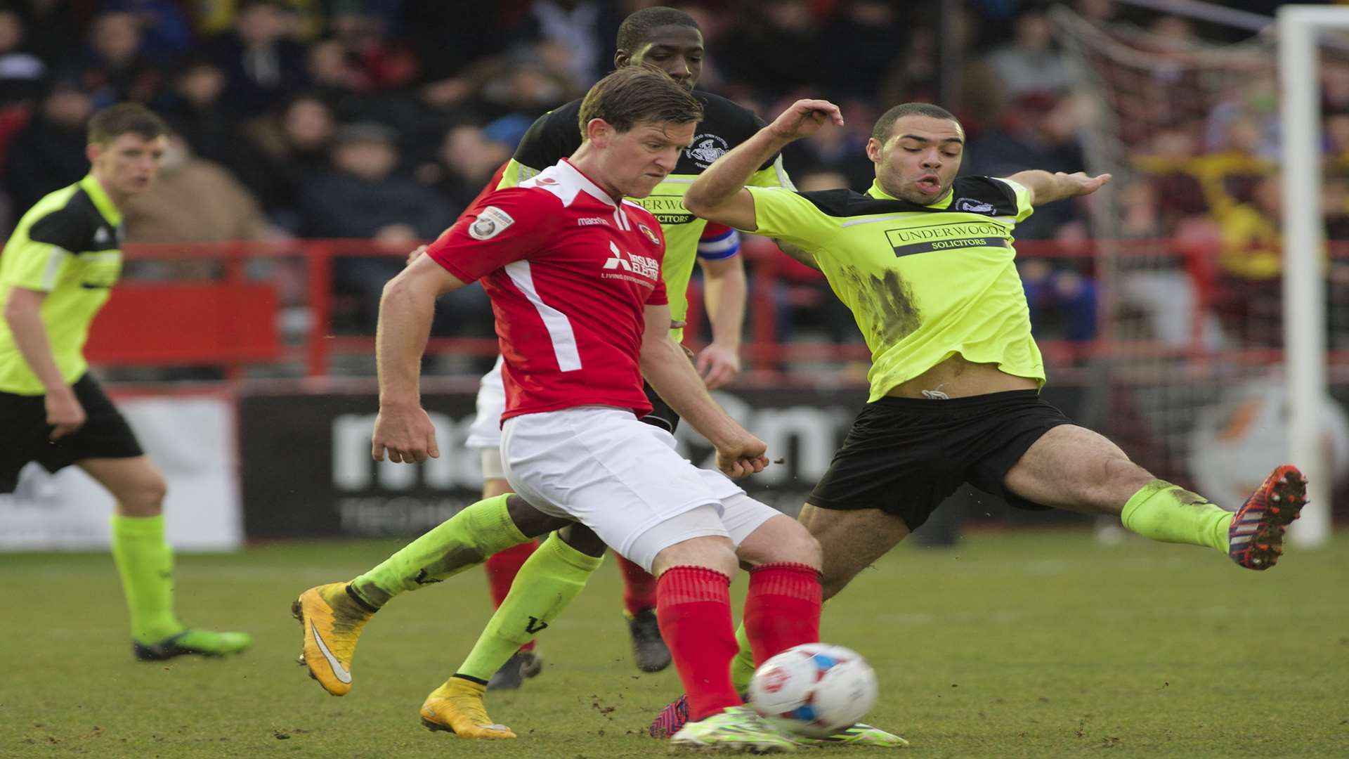 Adam Cunnington tries to play the ball under pressure Picture: Andy Payton