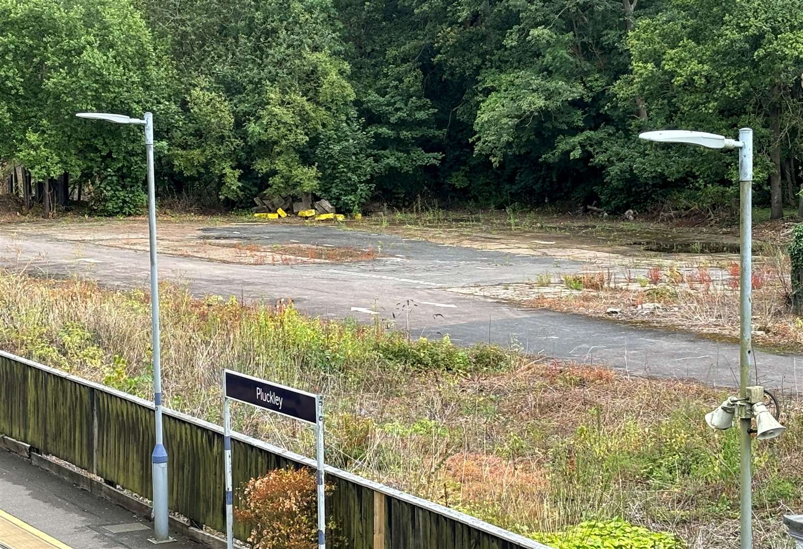 Plans to convert a derelict plot of land next to Pluckley railway station have been thrown out