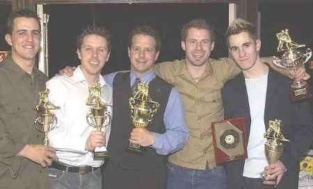 CELEBRATION TIME: Phil Chard, centre, with other award winners. Picture: ANDREW WARDLEY