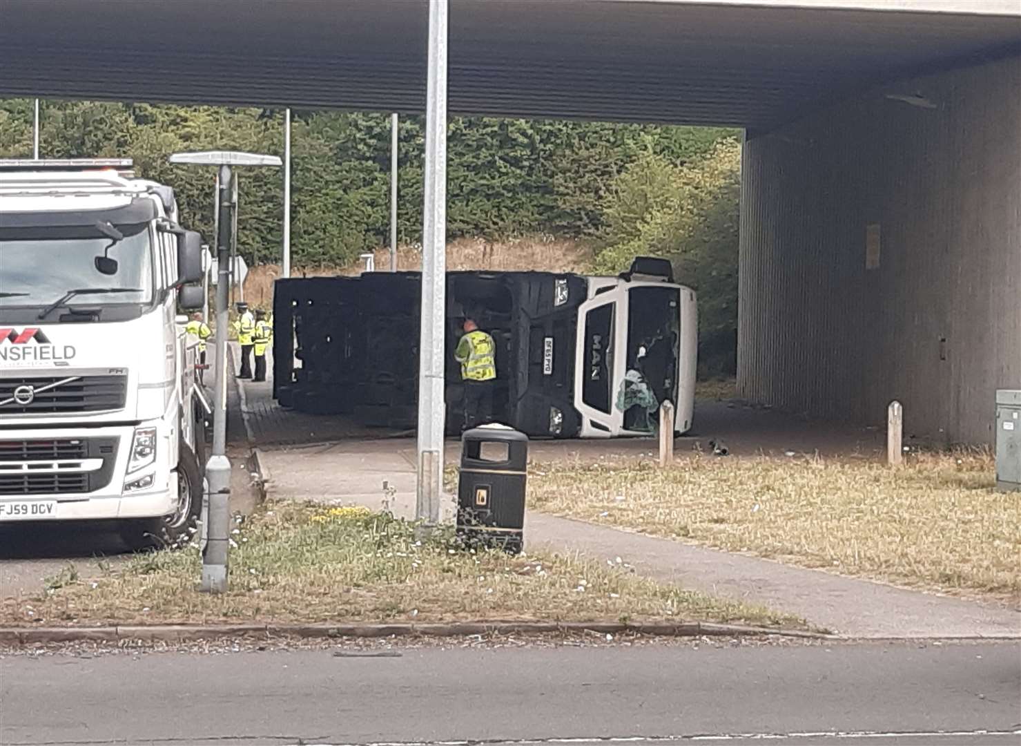 A lorry has overturned on the road under the A249 at Bobbing