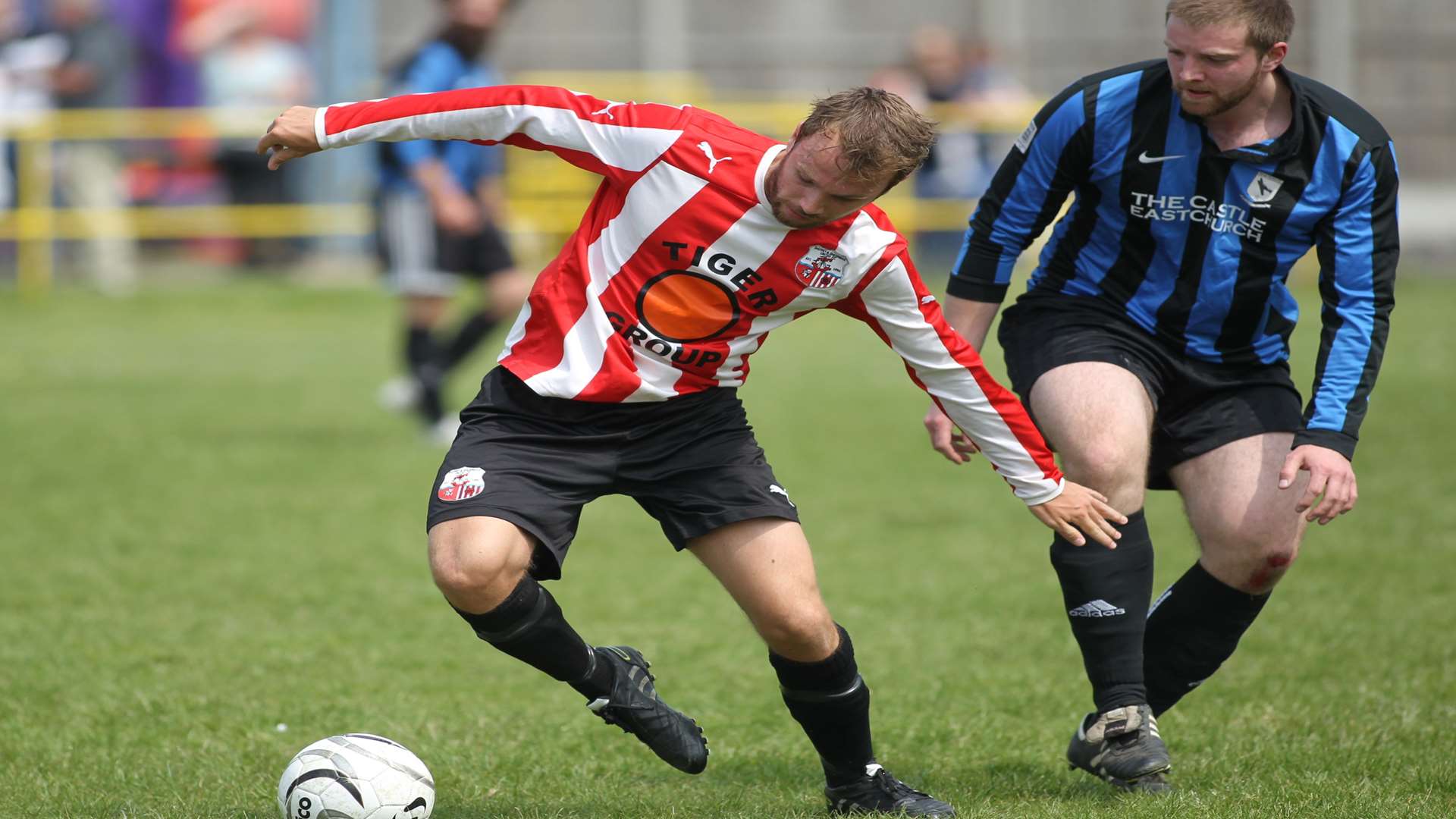 Action from last year as Range Rovers in blue and black from Eastchurch play Sheppey United in red and white at Sheerness East Working Men's Club.