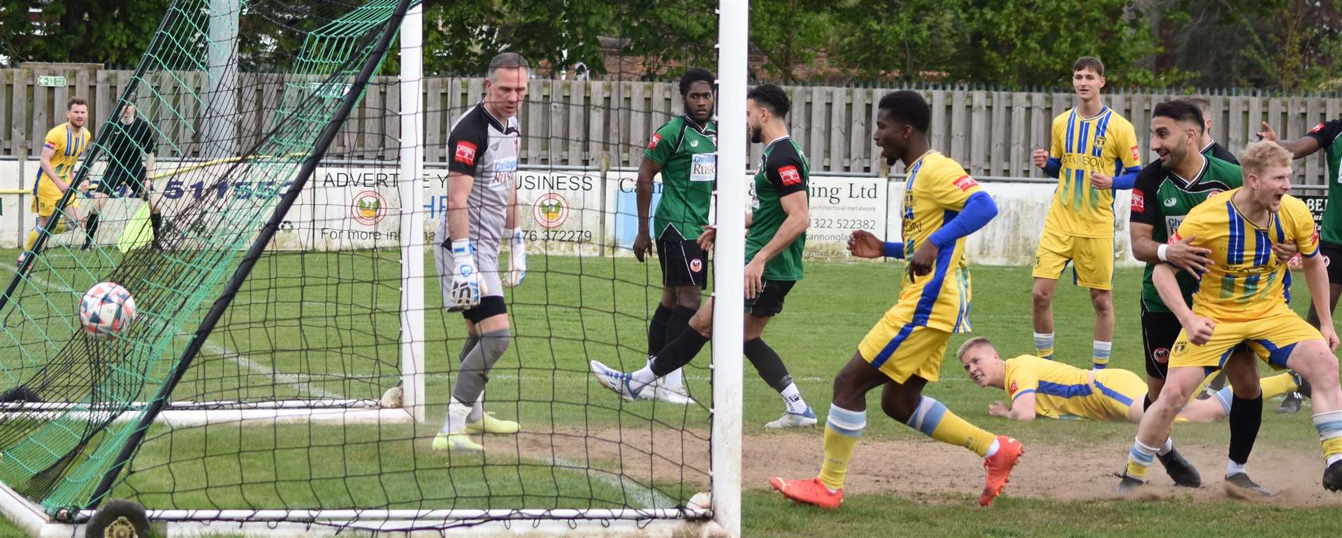 Joe Tyrie (grounded) scores Sittingbourne's second at Phoenix. Picture: Alan Coomes