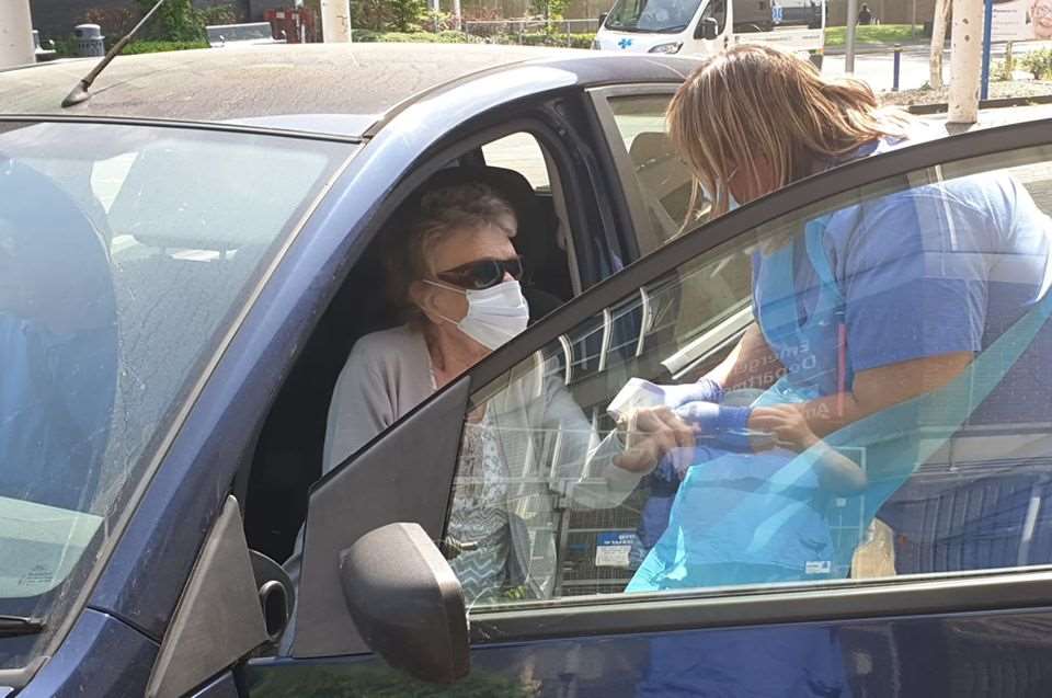 A patient arrives at the drive-through injection clinic at University Hospital Southampton (UHS/PA)