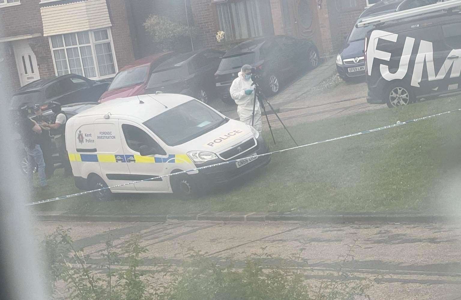 Police in Mooring Road, Rochester, following the attack in Gillingham