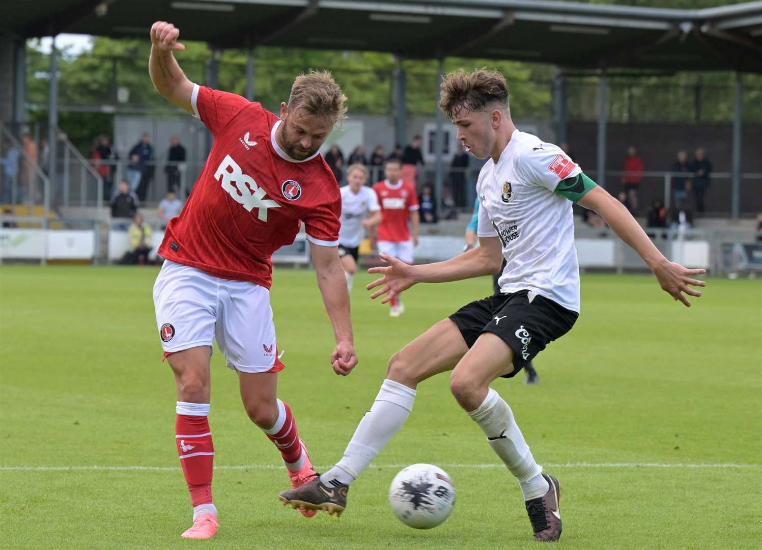 Dartford’s George Whitefield challenges Charlton’s Matt Godden in pre-season. Picture: Keith Gillard