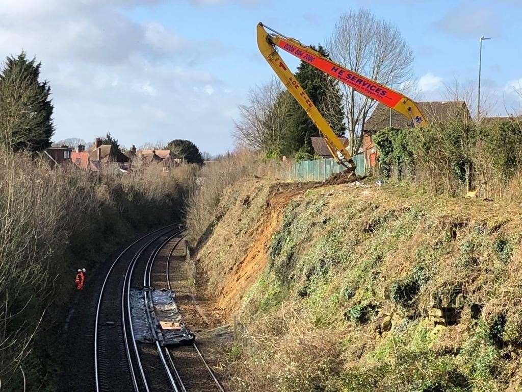 Network Rail teams examine a landslip near Bearsted last March. Picture: Derek Butcher