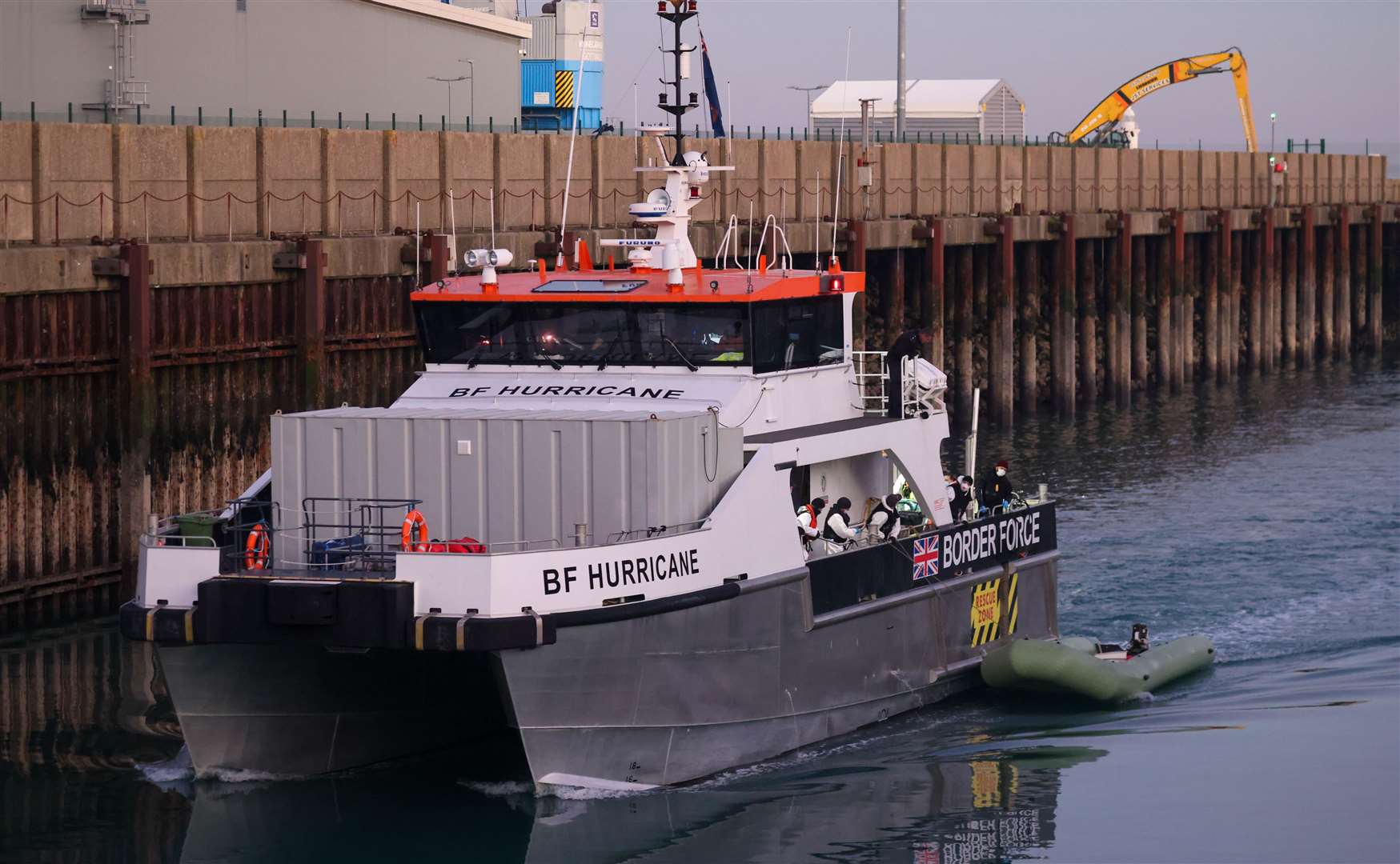 Migrants arriving at Dover on the Border Force boat Hurricane after being picked up near Ramsgate. Photo: UK News In Pictures