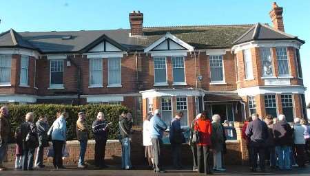 ANXIOUS WAIT: the queue outside the dental surgery. Picture: MATT WALKER