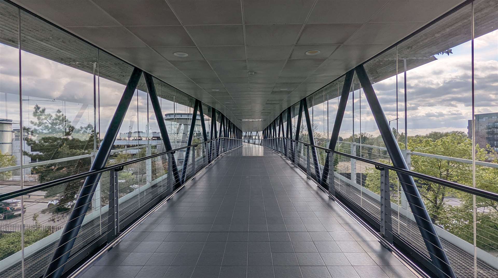 A deserted walkway between the station and multi-storey car park