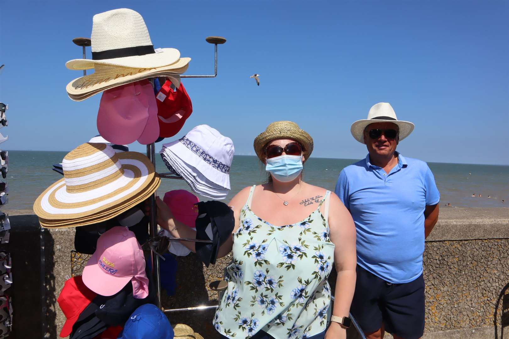 Hats the way to do it: Rosie Pullen of Fun Land finds a customer in Vanny Brown of Kent Roffing and Guttering at Leysdown