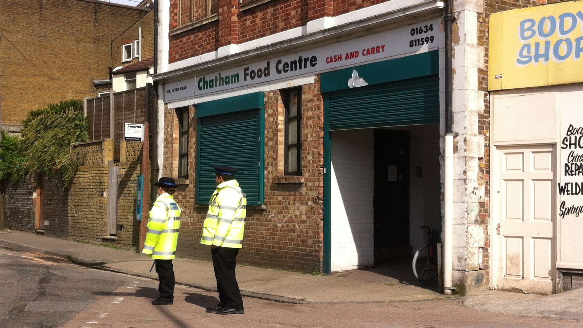 Police outside the store as the jury are shown around