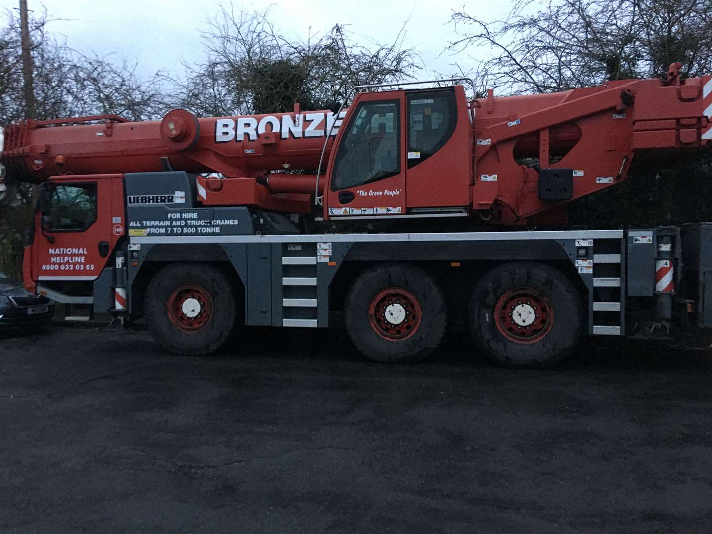 Residents parked to stop a large red crane truck being driven onto Bowmans Heath