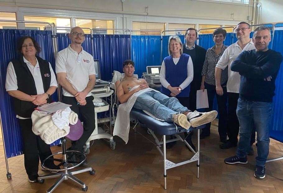 The CRY staff, Janice Wand, Rob Sargent, Dr Deléne Wassermann and Peter Lewis, with Ben's Mum Donna in the blue sleeveless jumper, and his Dan, on the far right, with MP Louie French, standing behind Donna, and test subject George Palmer