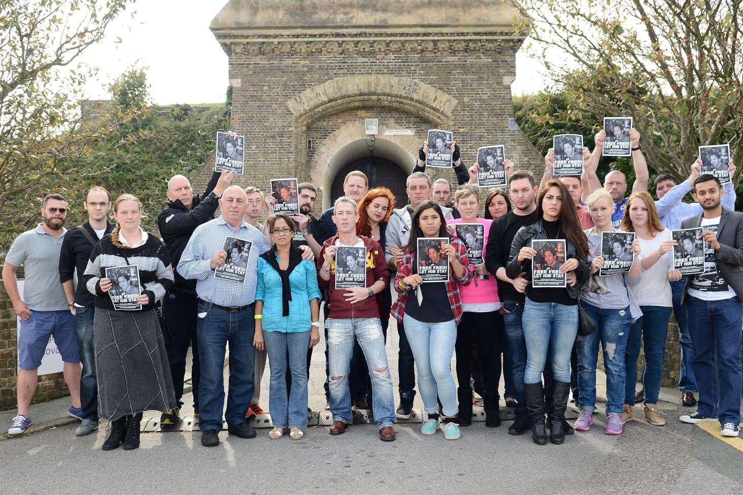 Friends and family of Fred Buenavista protest against the decision to deport him