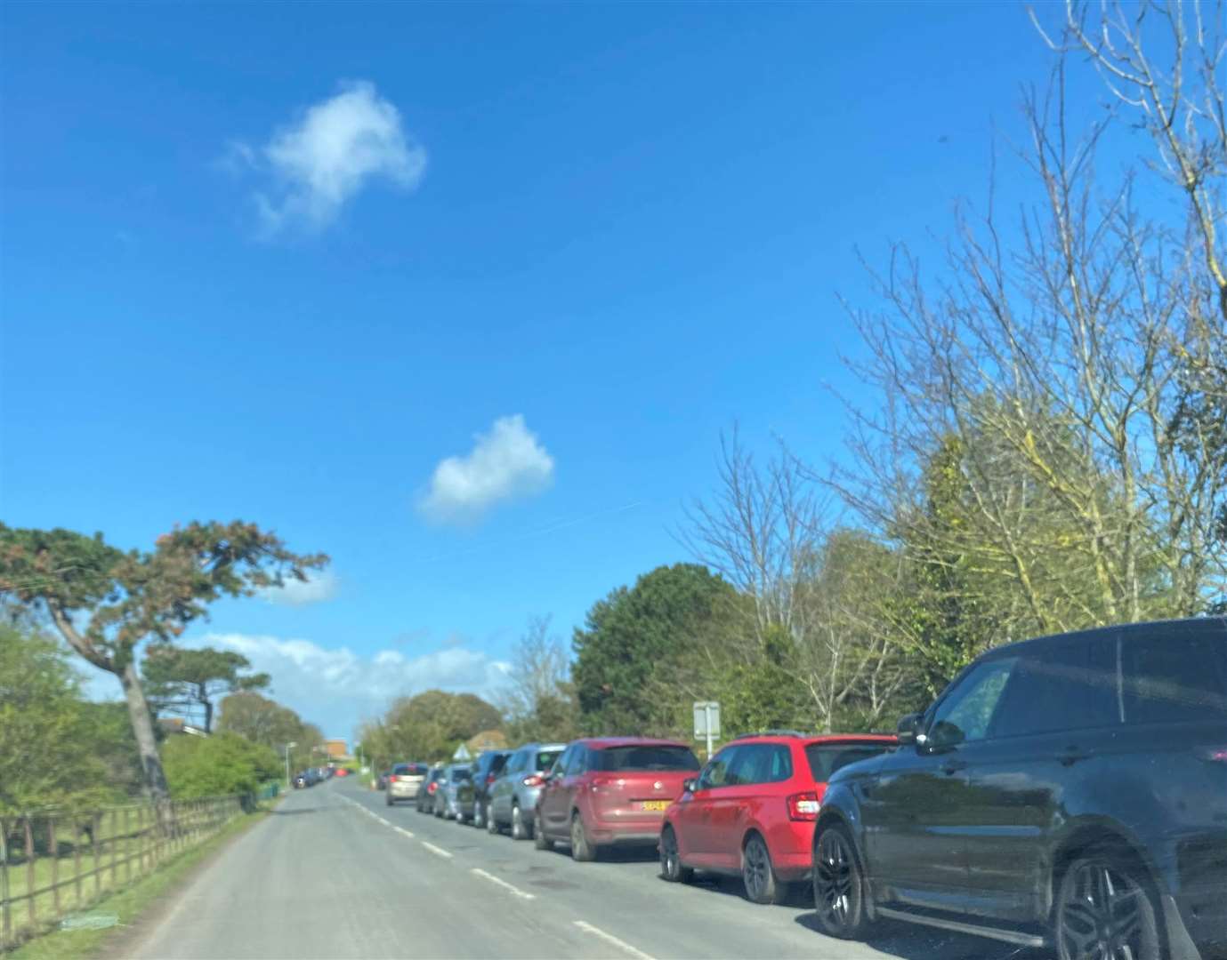 Cars parked along Kingsdown Road, outside Walmer Castle, instead of using the other car parks available