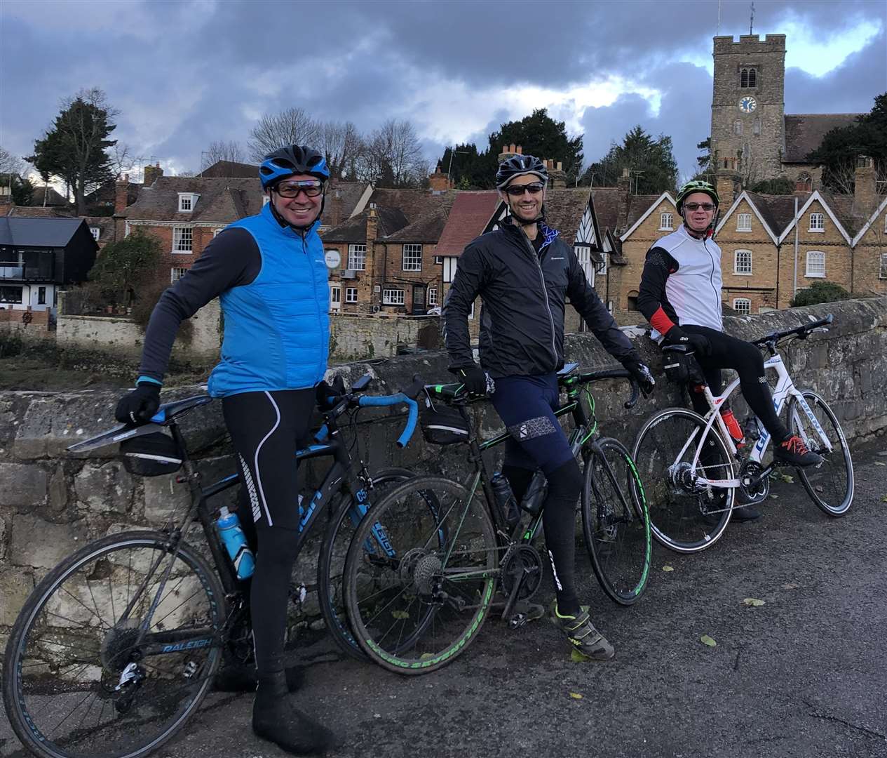 In December, six months to the day doctors told Mark, pictured in blue, he had six months to live he took part in a 75-mile bike ride calling it the 'Not Dead Yet Ride'