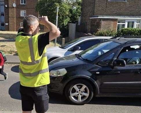 Darren was volunteering as a lollipop man outside the school. Photo: Darren Povey