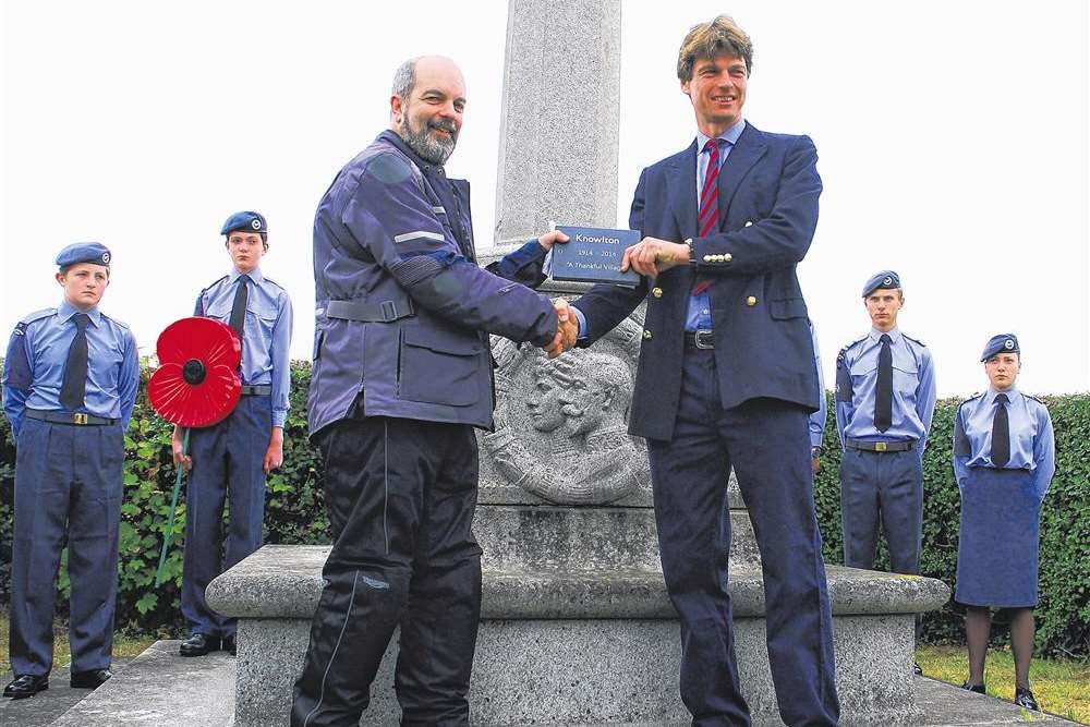 Thankful Villages run rider Medwyn Parry presents the slate plaque to Andrew Fox-Pitt, of the Knowlton estate