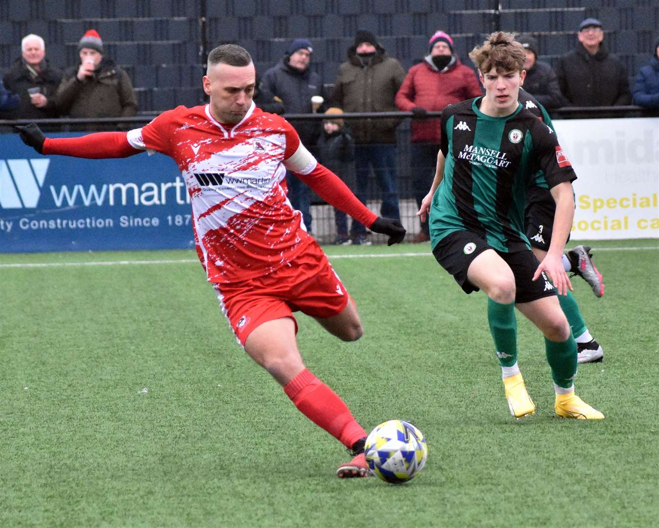 Joe Taylor in the thick of the action against Burgess Hill on Saturday Picture: Randolph File