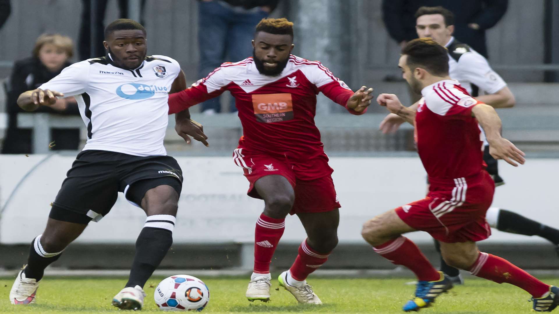 Dartford's Mark Onyemah is challenged by Whitehawk's former Ebbsfleet defender Chris Sessegnon. Picture: Andy Payton