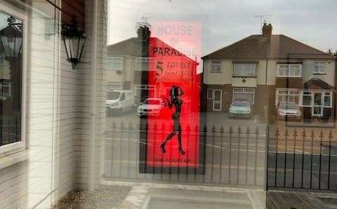 I took this photograph when the pub was closed, hence the reflection in the glass, but it’s the first thing you see and reads: “House of Paradise – 5 lovely hostesses waiting to welcome you, one flight up”