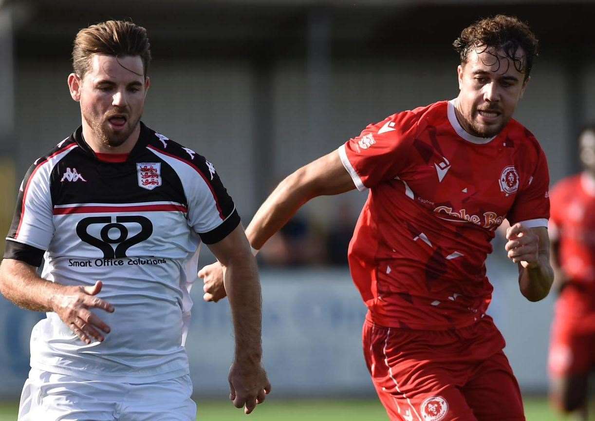 Faversham winger Ashley Miller in the thick of it. Picture: Ian Scammell