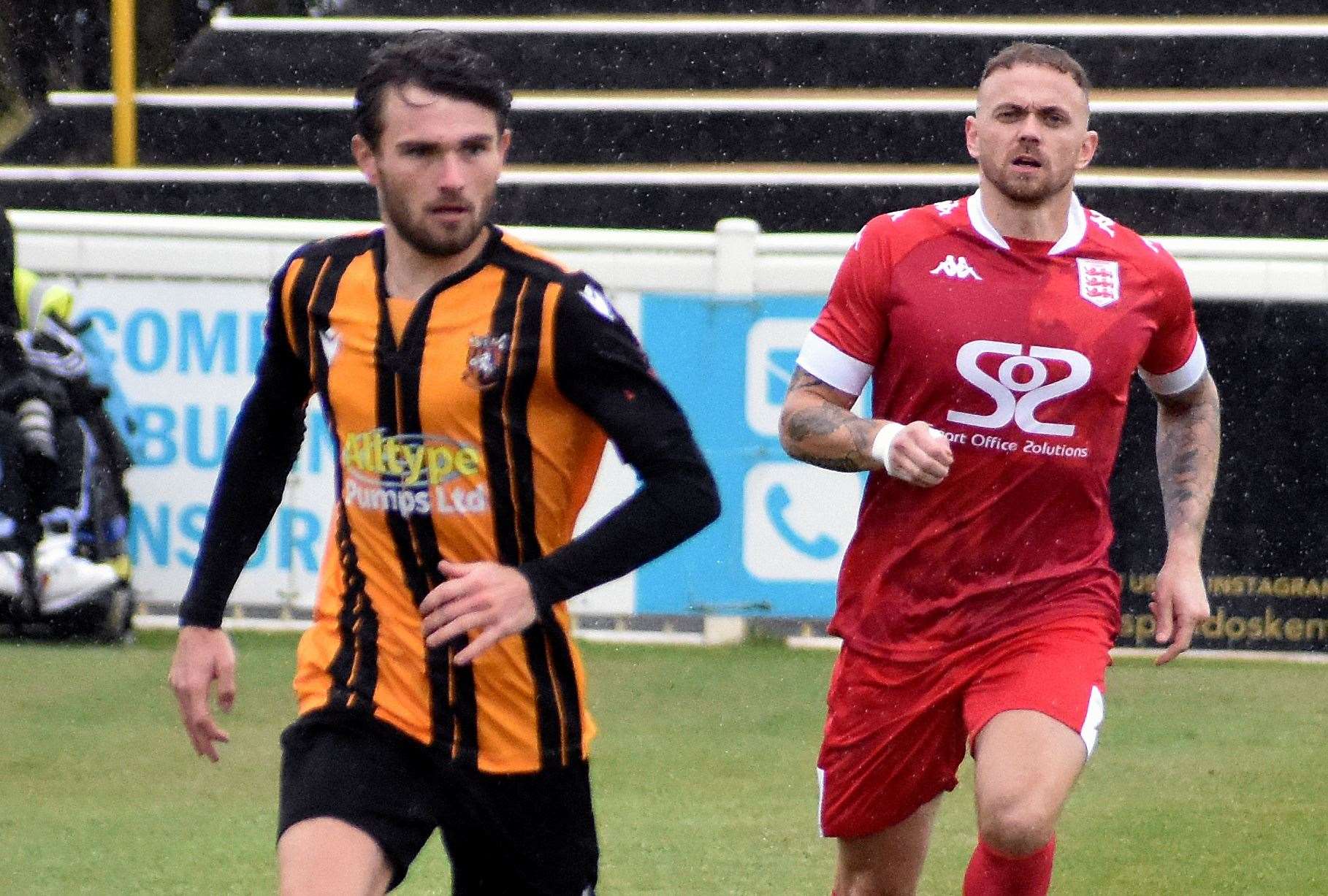 Midfielder Kane Penn, of Folkestone, gets away from Faversham's Matt Parsons. Picture: Randolph File