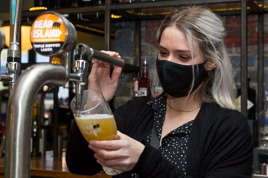 Staff pulling pints at the Spitfire pub in Kings Hill