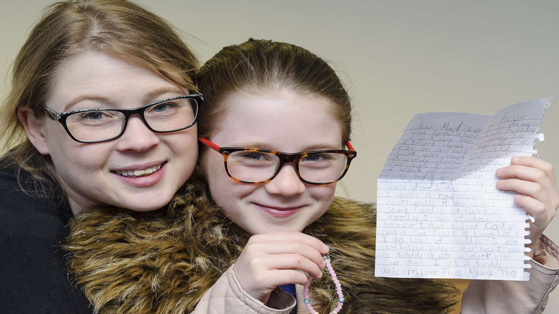 Charmaine with Madison, Ruby's letter and Madison's bracelet present for Ruby. Picture: Andy Payton