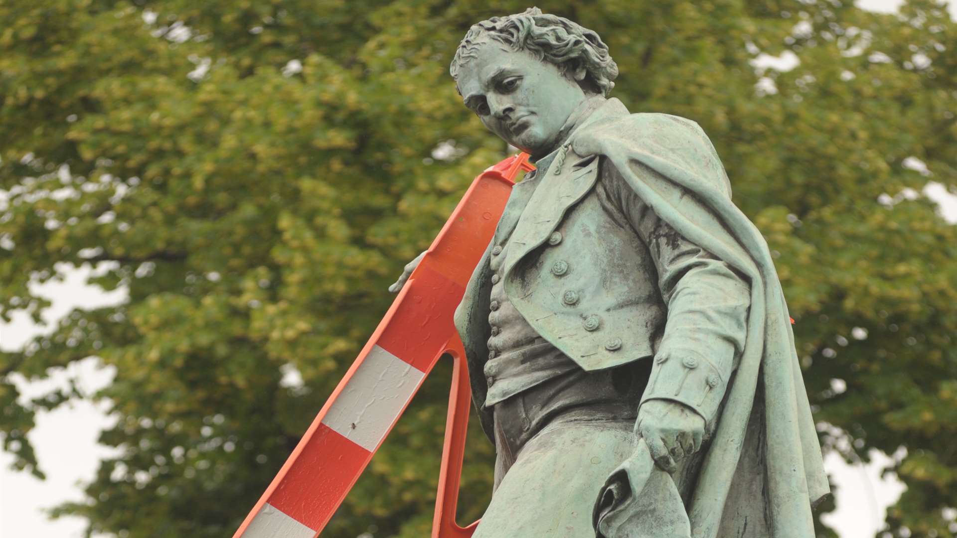 The Thomas Waghorn statue in Railway Street, Chatham, complete with road barrier accessory