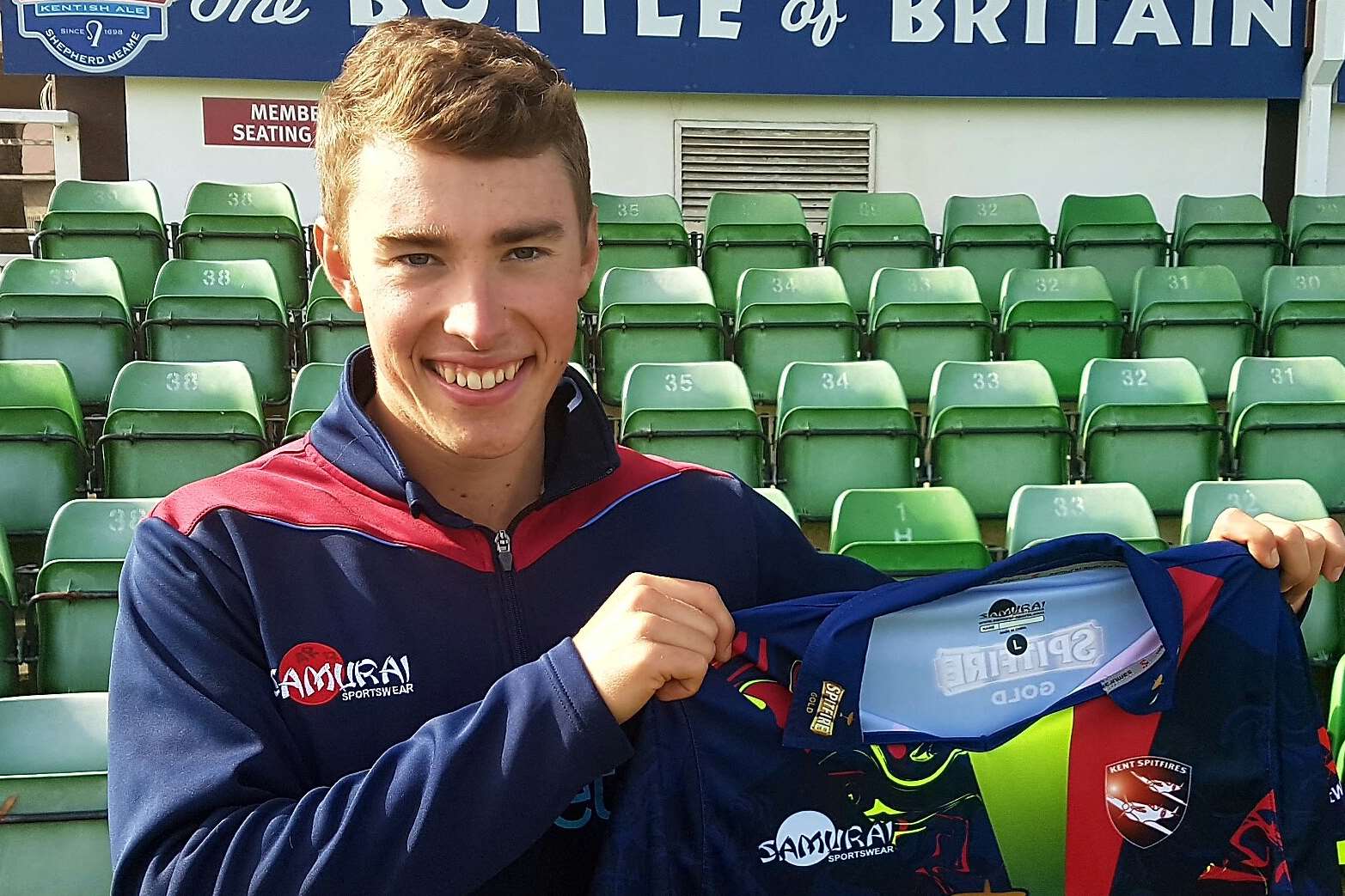 Joe Weatherley holding Kent's new T20 shirt for 2017