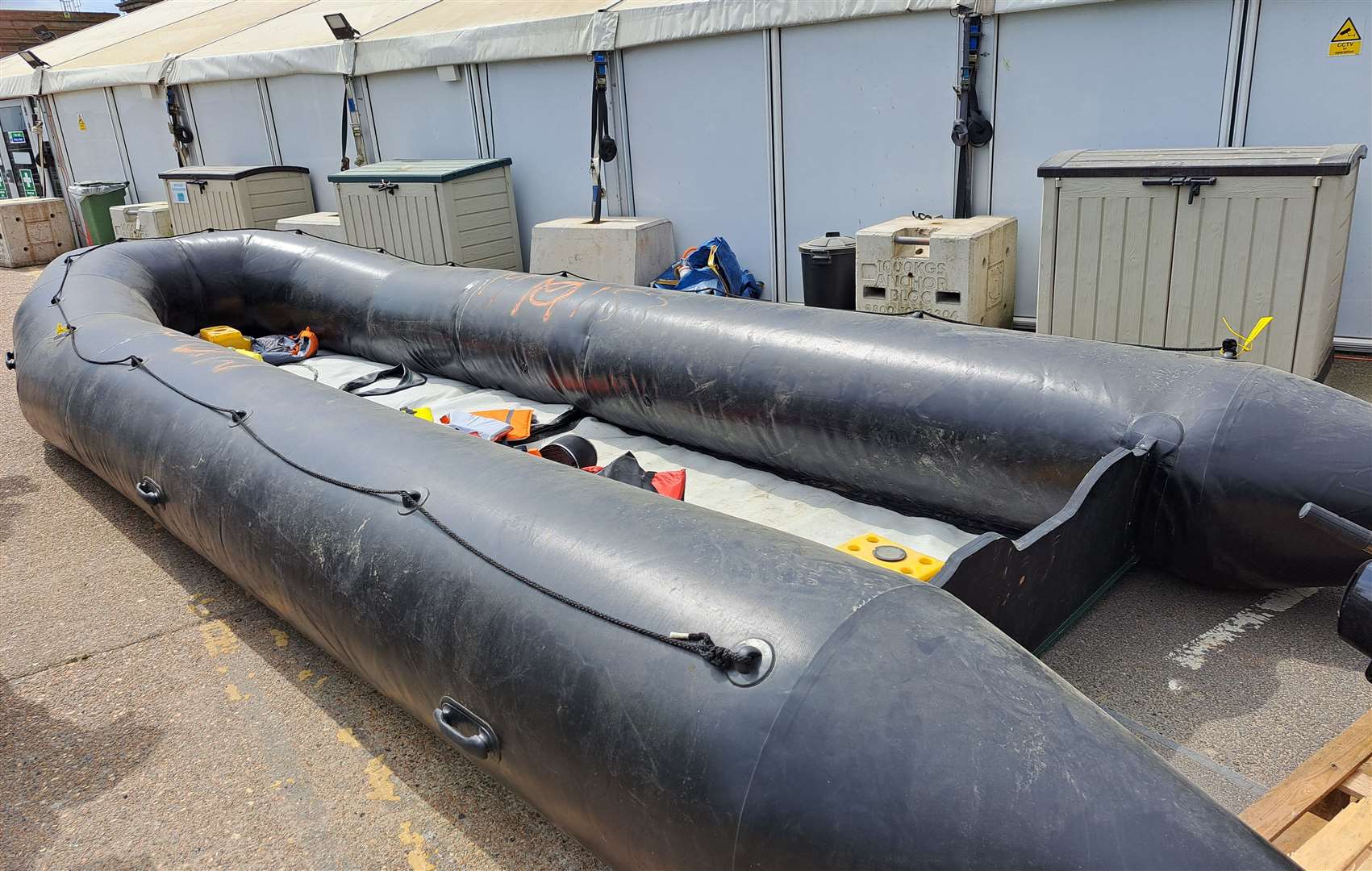 Photo of asylum seeker dinghy at Dover's Western Jet Foil centre, which can take 60 people