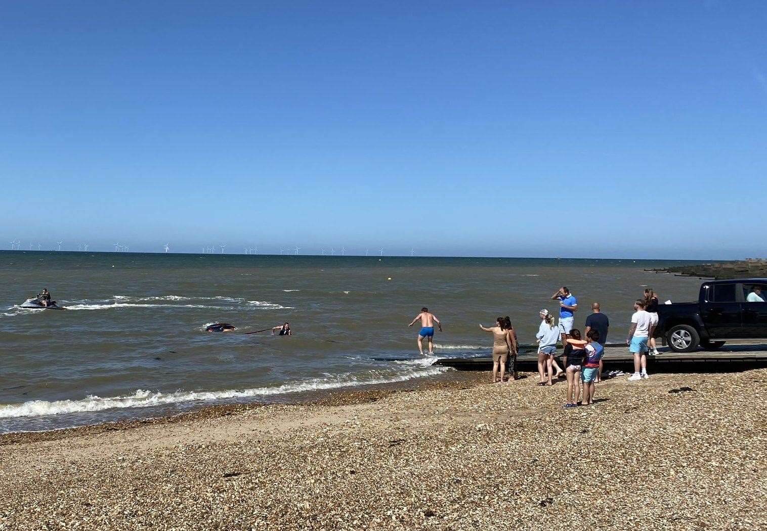 A 4x4 helped bring the car back to shore