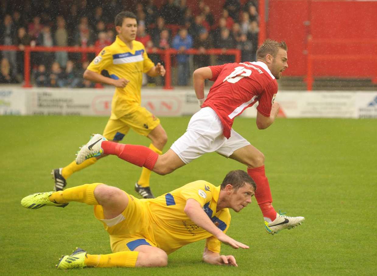 Matty Godden hurdles a Wealdstone challenge Picture: Steve Crispe