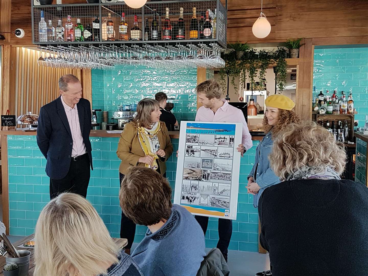 Council chairman Cllr Sue Chandler presented new managers Tim Biggs and Rebecca Hodson with a potted history of the pier