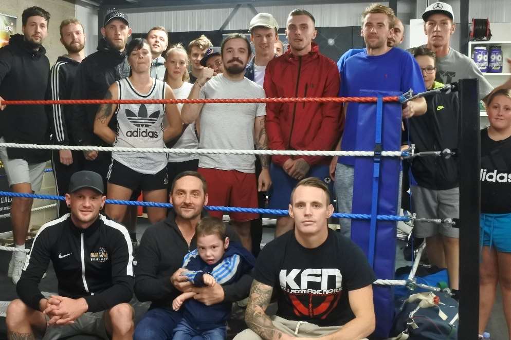 Archie and dad David meeting the fighters at the Golden Glove Academy