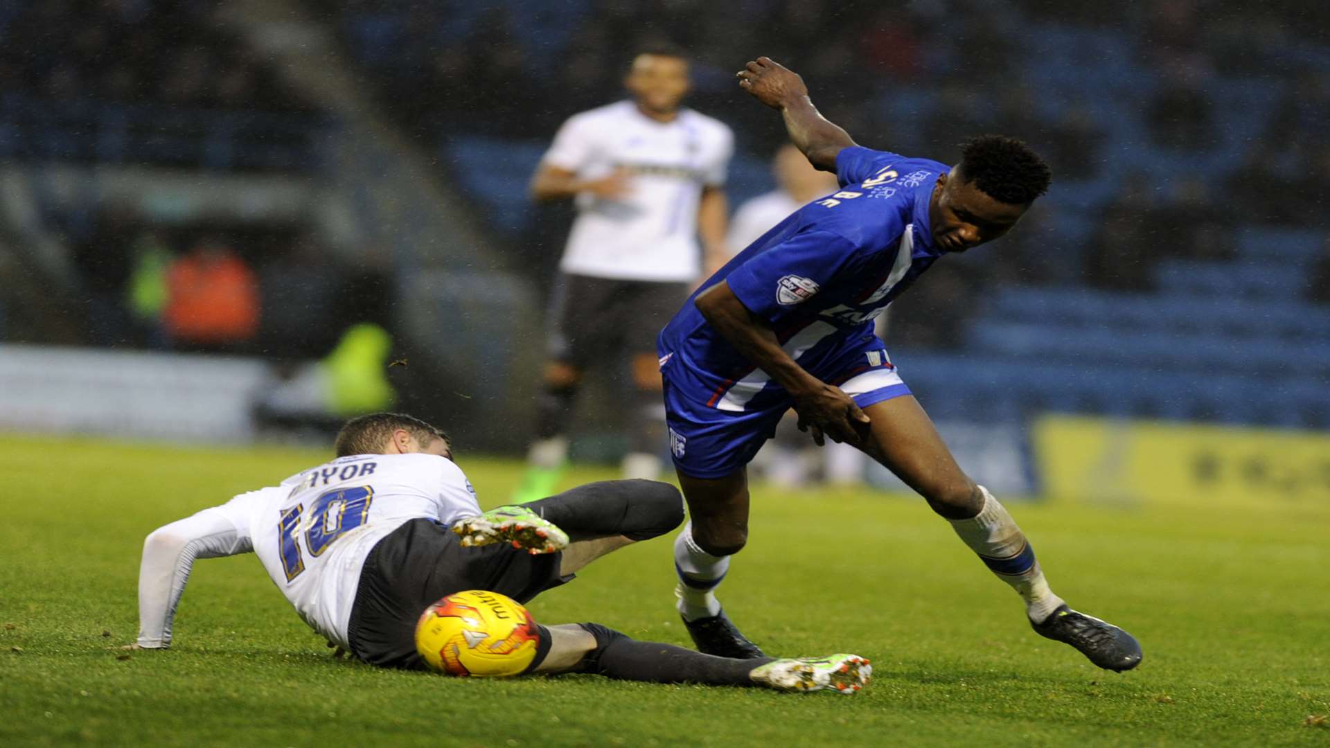 Emmanuel Osadebe beats Bury's Danny Mayor Picture: Barry Goodwin