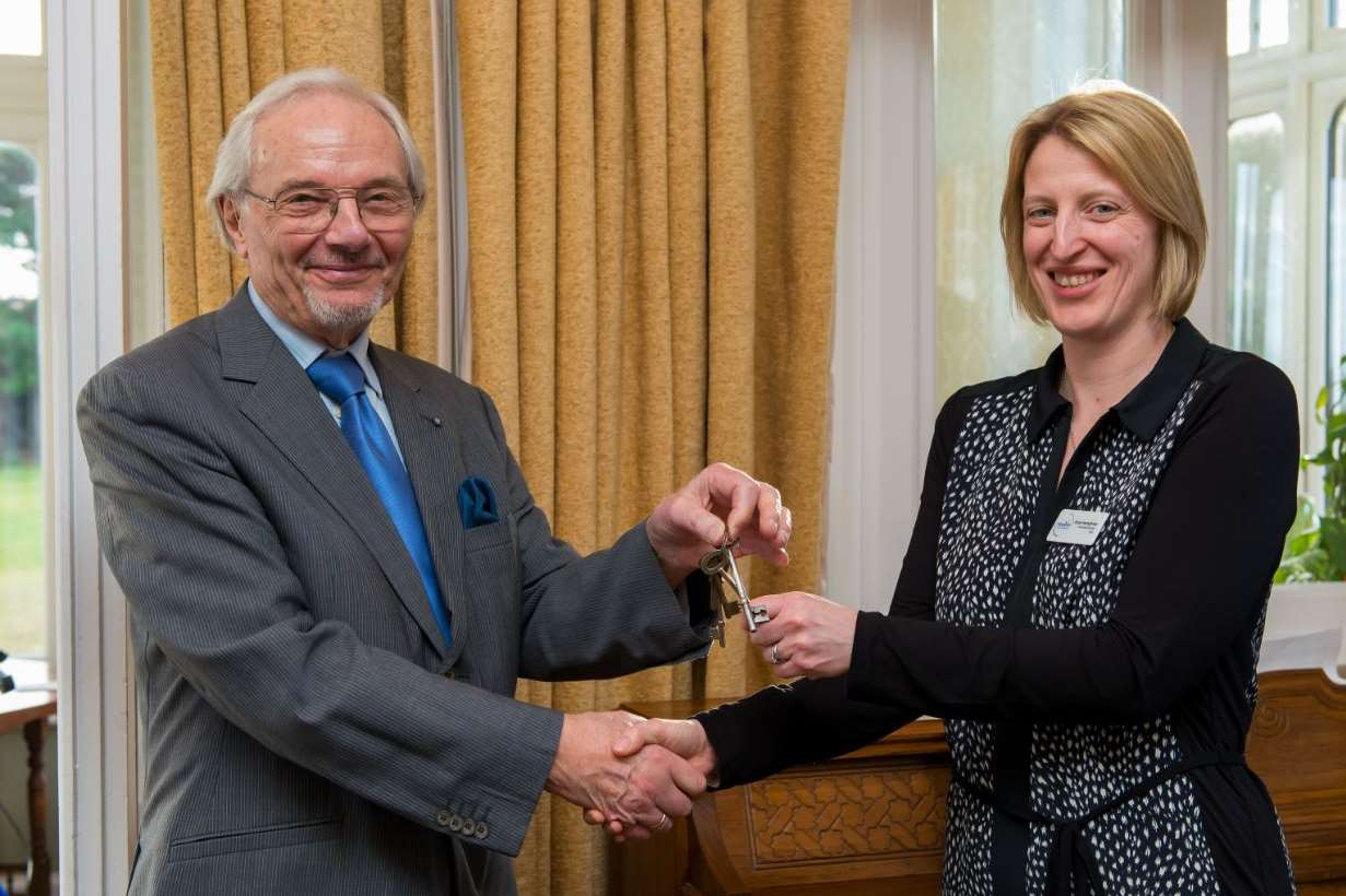 Sir Alastair Hunter hands the keys to Buckmaster House to Anna Humphries