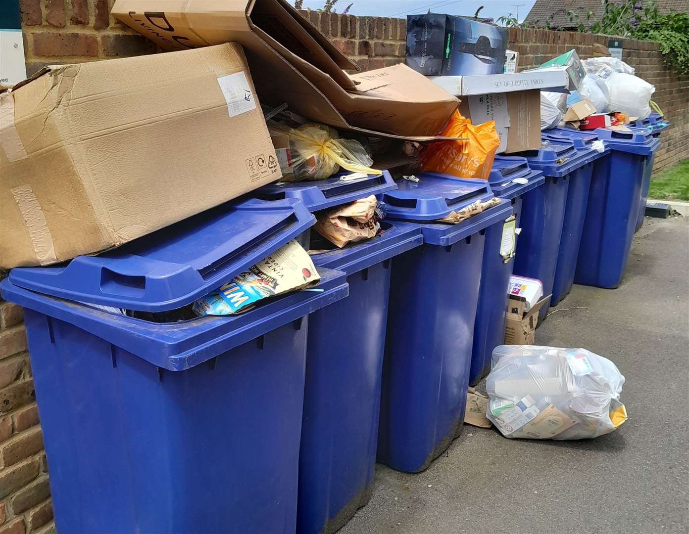 The recycling bins at Clarity Mews along London Road in Sittingbourne are overflowing. Picture: Vincle Kindlin