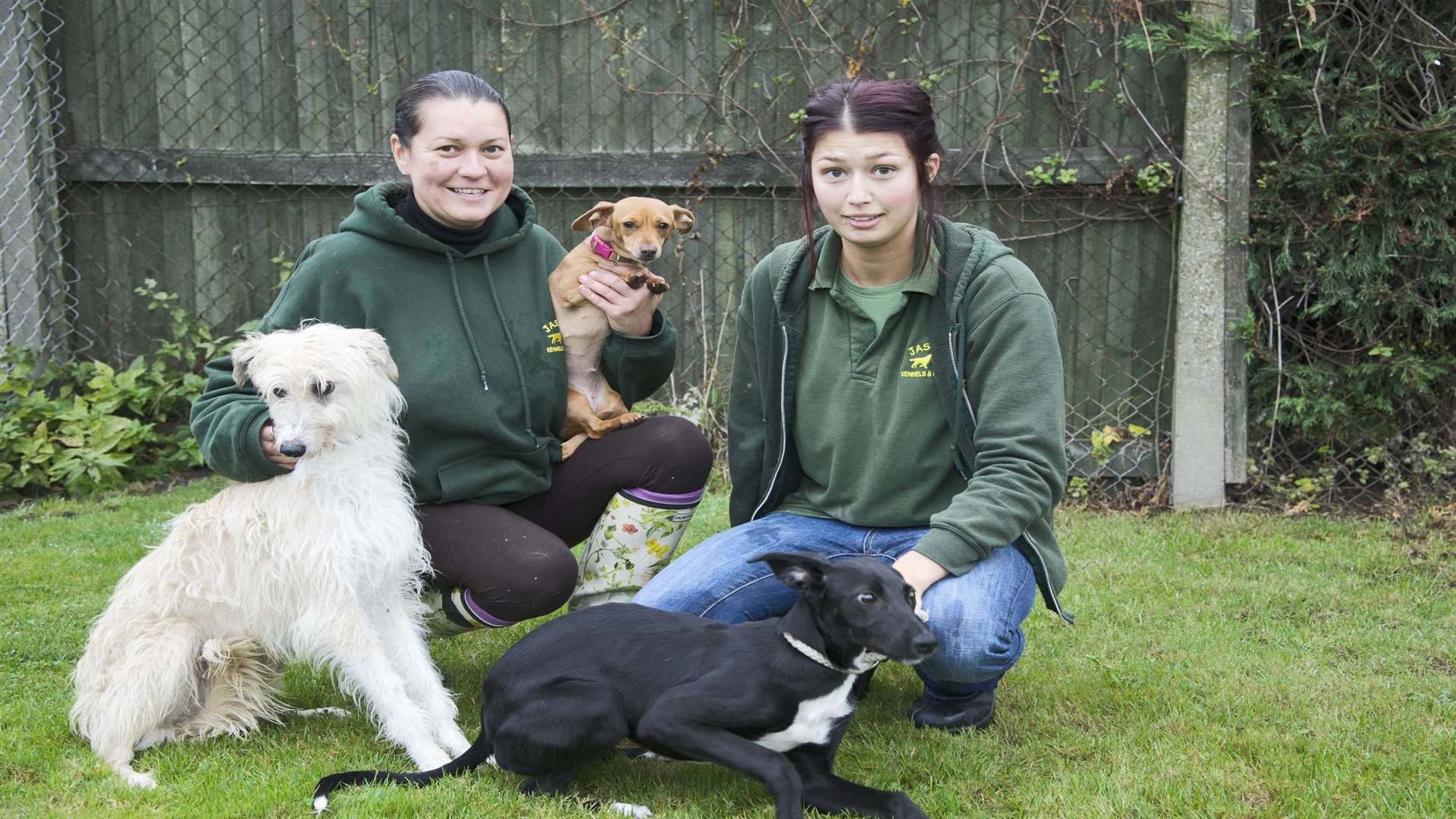 Corrina Shuttlewood, left, and Katie Hogan, with from left, Oscar, sausage and Socks.