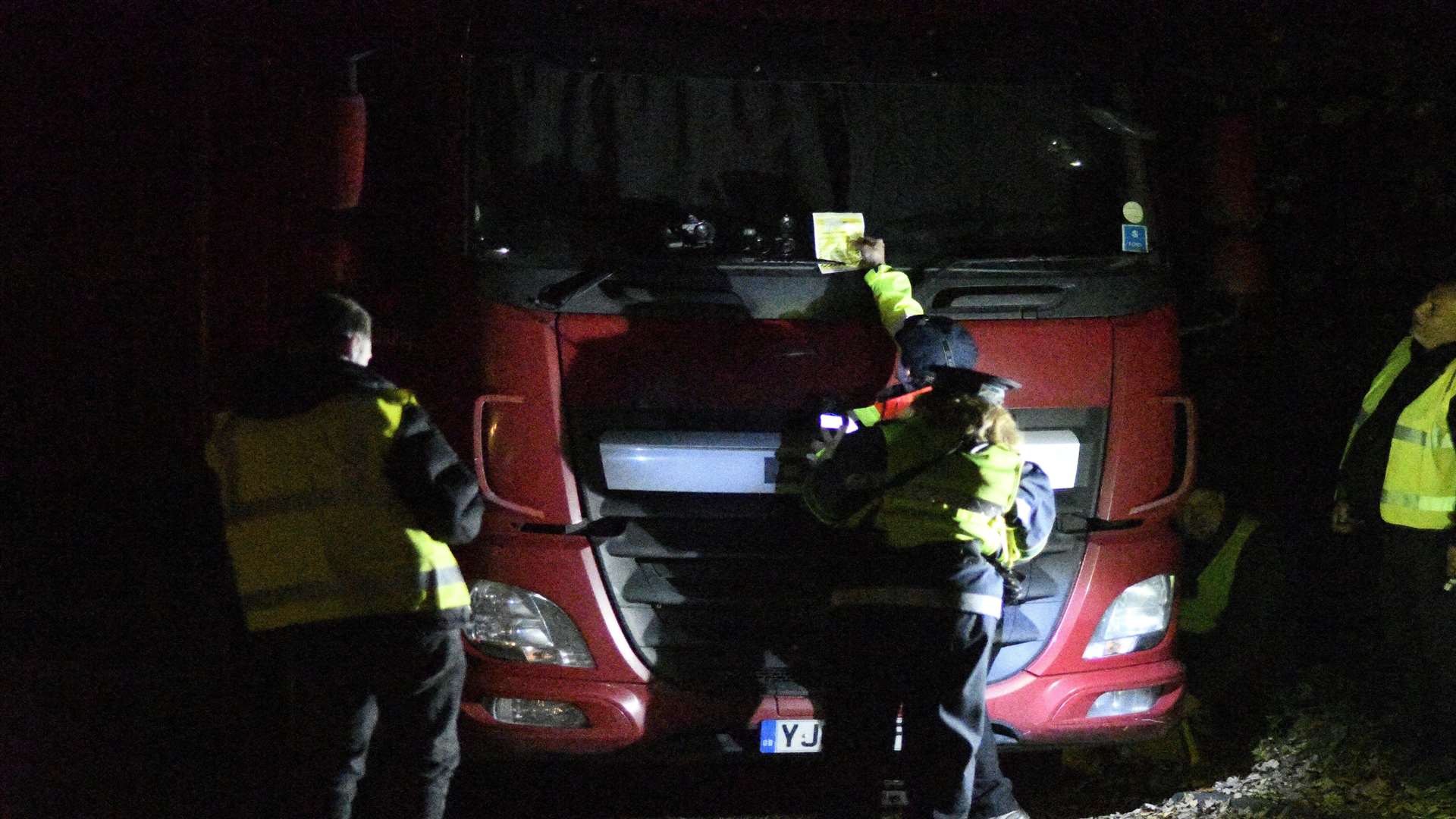 Officials clamp a lorry off the A20. Picture: Barry Goodwin