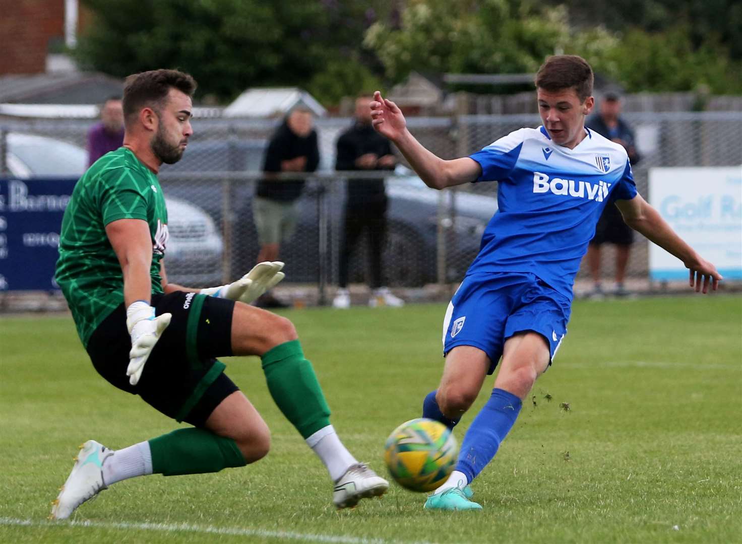 Deal goalkeeper Henry Newcombe clears in front of a Gillingham player. Picture: Paul Willmott