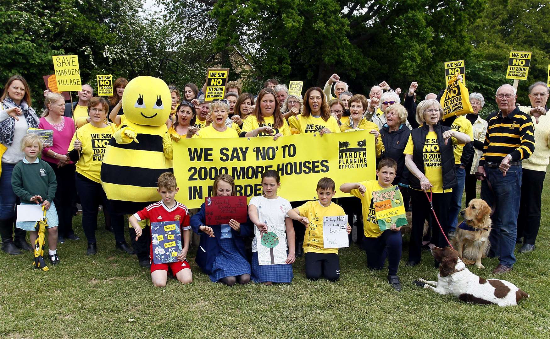 Helen Grant MP (centre) joins protesters for a pre-march photocall before their planned demonstration in Marden tomorrow