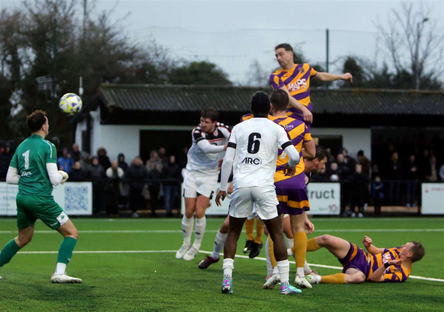 Midfielder Billy Munday rises above Faversham’s defence to make it 2-1 to Deal. Picture: Paul Willmott