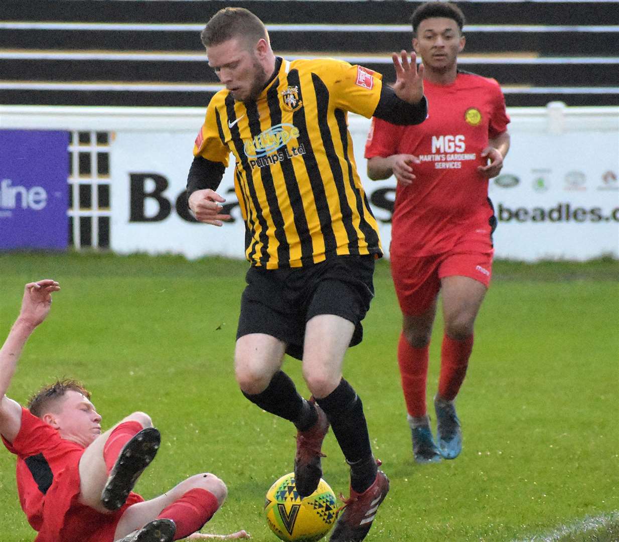 Folkestone's Scott Heard battles for the ball. Picture: Randolph File