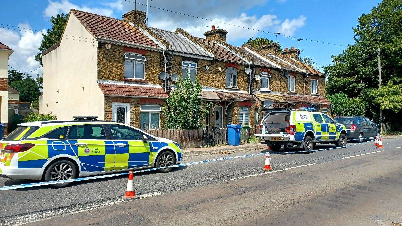 Police outside homes in North Street in Milton Regis, Sittingbourne